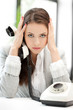 stressed and tired businesswoman with cell phone