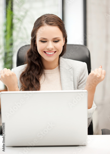 Photo: smiling businesswoman celebrating victory or win smiling businesswoman celebrating victory or win