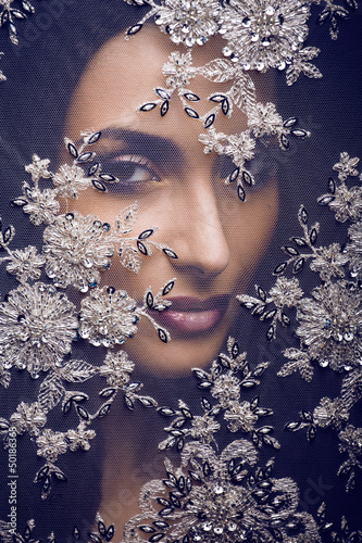 Photo: portrait of beauty young woman through lace portrait of beauty young woman through lace