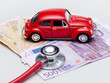 Car with stethoscope and money to show the cost increase