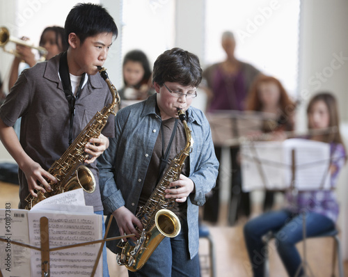 Photo: Students playing saxophones in music class Students playing saxophones in music class