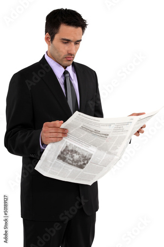 Photo: Businessman reading the newspaper Businessman reading the newspaper