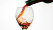Red wine pouring into glass