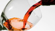 Red wine pouring into glass low angle view
