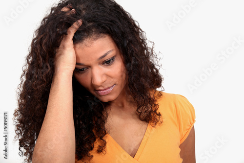 Photo: Woman holding her head Woman holding her head