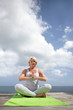 Woman practicing yoga outdoors