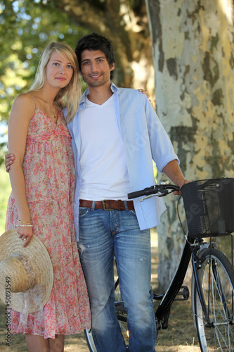 Photo: Couple biking on a summer's day Couple biking on a summer's day