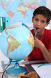 Little boy in classroom, looking bored