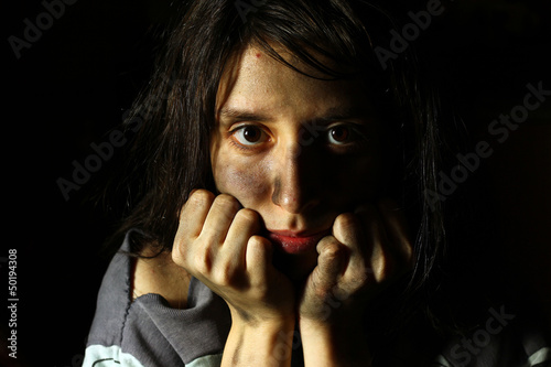 Photo: Poor dirty girl looking at the camera Poor dirty girl looking at the camera