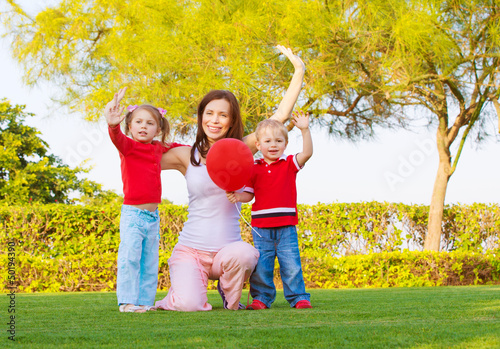 Photo: Happy family in spring park Happy family in spring park