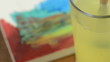 Cleaning a brush with blue water color in a water glass