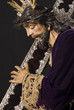 jesus with mahogany and silver cross on the shoulder