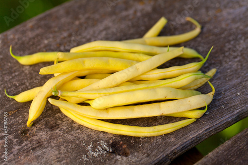 Photo: yellow kidney beans on wooden table yellow kidney beans on wooden table