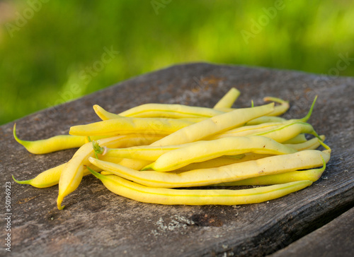 Photo: yellow kidney beans on wooden table yellow kidney beans on wooden table