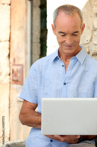 Photo: Man with computer Man with computer