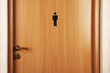 Toilet sign on wooden door