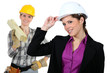 Women with construction helmets