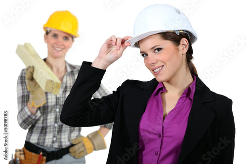 Photo: Women with construction helmets Women with construction helmets