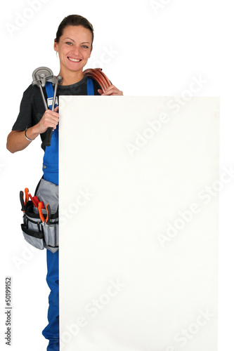 Photo: plumber with tools of the trade and board for message plumber with tools of the trade and board for message