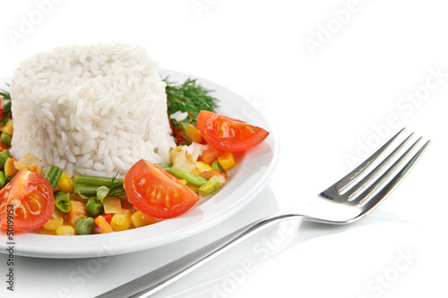 Photo: Delicious risotto with vegetables, isolated on white Delicious risotto with vegetables, isolated on white