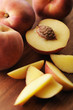 Peach cut in half with focus on peach pit.