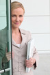 Woman opening door to a collaborator