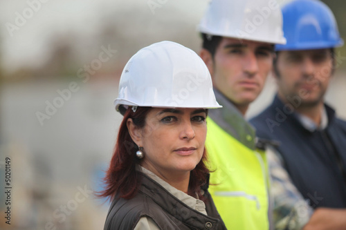 Photo: Architect and builders on site Architect and builders on site