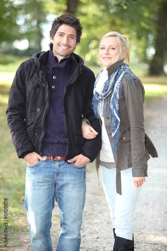 Photo: Couple walking in the park Couple walking in the park