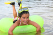 Young girl learning to snorkel