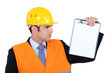Engineer holding up note-pad
