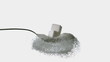 Sugar cubes falling onto spoon full of sugar