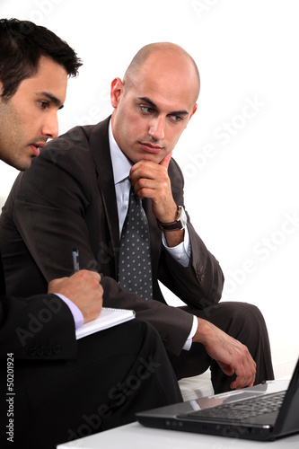 Photo: Two businessmen problem solving Two businessmen problem solving