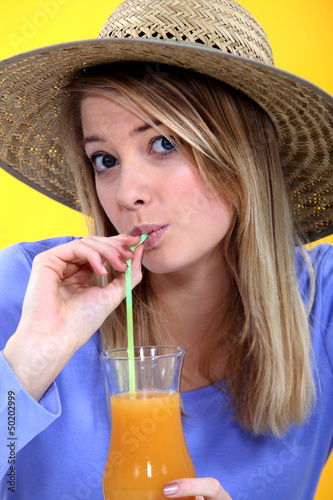 Photo: Woman drinking juice Woman drinking juice
