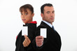 Business professionals holding their business cards