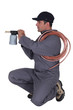 Man aiming a blowtorch