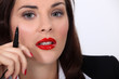 Businesswoman wearing bright red lipstick