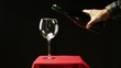 wine bottle and glass over black background