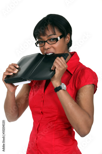 Photo: Woman biting diary Woman biting diary