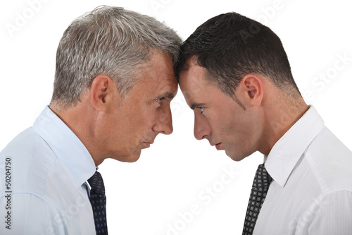 Photo: Businessmen stood head-to-head Businessmen stood head-to-head