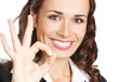 Businesswoman with okay gesture, isolated