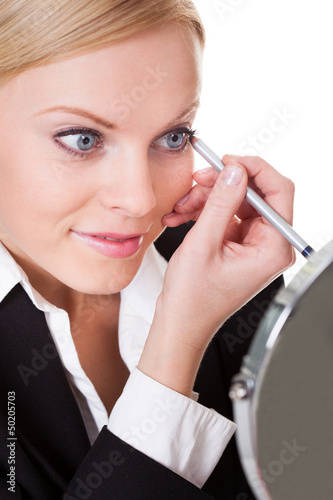 Photo: Attractive businesswoman drawing with eyeliner Attractive businesswoman drawing with eyeliner