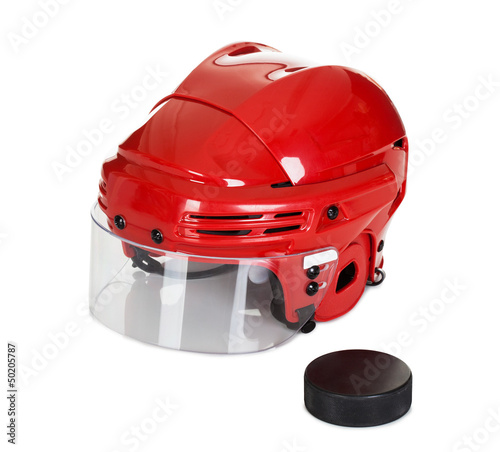 Photo: Hockey helmet and puck Hockey helmet and puck