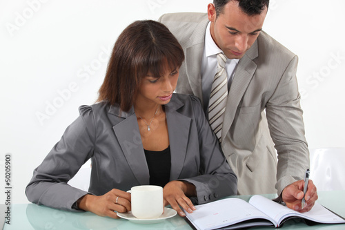 Photo: Business people at a desk Business people at a desk