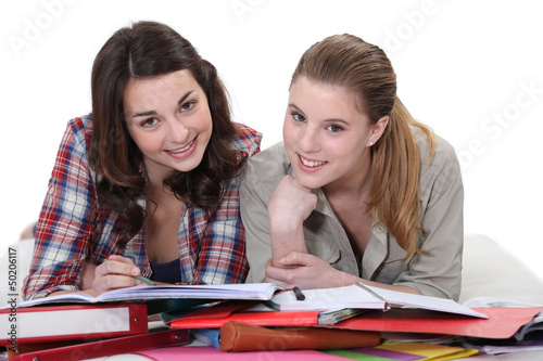 Photo: Two female students revising together Two female students revising together