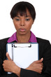 Afro-American businesswoman holding a notepad
