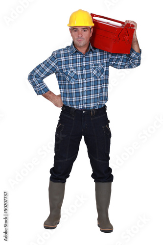 Photo: Workman with a tool box Workman with a tool box