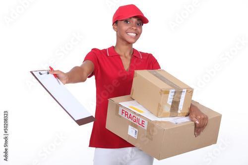 Photo: Young courier delivering parcels Young courier delivering parcels