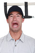 A man with a clamp on his head.