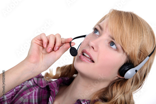 Photo: Woman with a telephone headset Woman with a telephone headset
