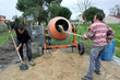Photo: Two men mixing cement Two men mixing cement